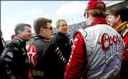 President Bush, center, meets with NASCAR drivers, from left to
right, Joe Nemechek, Jaime McMurray, Sterling Marlin and Johnny
Benson before the start of the Daytona 500 NASCAR race. The "NASCAR
dad" demographic is highly coveted among this year&squot;s presidential
candidates.