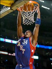 Paul Pierce dunks during the NBA All-Star Game. Pierce, a former
Kansas University standout, scored eight points for the Eastern
Conference during Sunday's game at Los Angeles. The Western
Conference won, 136-132.