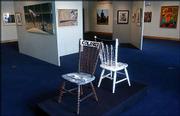 An installation of chairs by New Jersey artist Courtney Walls
called "The Same Game" symbolically interprets a double standard in
baseball, with one chair painted white and the other black. It&squot;s
part of the "Shades of Greatness" exhibit at the Louisville Slugger
Museum in Louisville, Ky.