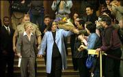 Rosie O'Donnell, center, gets a flower bouquet from well-wishers
shortly after marrying Kelli Carpenter in San Francisco. O'Donnell
married her longtime girlfriend Thursday, taking what she called a
proud stand for gay civil rights in the city where more than 3,300
other same-sex couples have tied the knot since Feb. 12.
