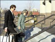 David Wittig, former Westar Energy Inc. chief executive, heads into
the federal courthouse in Kansas City, Kan., with his wife, Beth.
Wittig was sentenced in a federal loan-conspiracy case to more than
four years in prison, a $1 million fine and three years on
supervised release after his prison term.