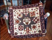 Mary Boucher, of Lawrence, left, and Joyce Colton, of Lecompton,
created the Sesquicentennial Sampler quilt with patterns
contributed by Lawrence quilt historian Barbara Brackman. The
quilt, commissioned by the Watkins Community Museum of History,
will be unveiled Saturday at the museum, 1047 Mass.