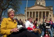 Gov. Kathleen Sebelius, left, sits next to Lawrence members of the
Big Tent Coalition. Seated from left are Kathy Lobb, representing
the Self Advocates Coalition of Kansas; Michelle Garrison, who is
on the developmental disability waiting list; and Brad Linnenkamp,
who has cerebral palsy and was dropped from a Medicaid waiver
program. Sebelius and coalition members on Wednesday attended the
annual Rally For Freedom outside the Statehouse in Topeka.
