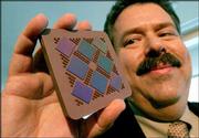 Bernard Meyerson, IBM fellow and chief technologist, displays a
Power5 multichip module. He touted the module Wednesday during an
IBM news conference in New York. IBM plans to collaborate and build
a community of innovation around its Power microprocessor
architecture, which can be used in devices such as game systems and
supercomputers.
