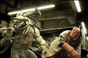 Hellboy, right, (played by Ron Perlman), takes on one of the many
monsters dreamed up by creator Mike Mignola. The author first
launched the "Hellboy" series in 1993 after years spent drawing
superheroes for DC and Marvel Comics.
