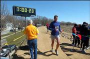 Nathan Price, 25, of Olathe, finishes the Brew to Brew run in North
Lawrence. The annual 42-mile relay and solo race was March 21. The
race benefits the Cystic Fibrosis Foundation.