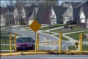 Residents along Harvard Road between Monterey Way and Wakarusa
Drive have long been frustrated with traffic speeding through their
neighborhood. After two years of temporary traffic-calming devices,
like these two at the road's intersections with Goldfield Street
and Grove Drive, the city is planning to install permanent devices.