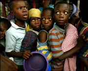 Los Angeles Times photographer Carolyn Cole is this year's winner
of the Pulitzer Prize for feature photography. Her submission for
the contest included this photo, of displaced children lining up
for food at a school complex in Monrovia, Liberia.