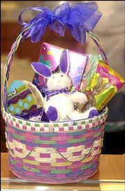 Easter baskets like this one, filled with a stuffed bunny and a
variety of chocolates, are proving popular with customers at
Russell Stover Candies, 1300 W. 23rd St.