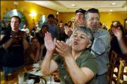 Angelina Marquez, front, and other supporters of "No On Measure 4A"
celebrate in Inglewood, Calif. Tuesday, voters rejected a ballot
measure that would have cleared the way for a Wal-Mart Supercenter
in this Los Angeles suburb.