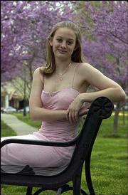 Kate Dempsey, Free State High School sophomore, models a dress from
Maurice's, 739 Mass., in her favorite color, pink.