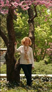 Silvia Kofler is one of two poets reading Friday for the fourth
installment of the 2004 Lawrence Poetry Series. She is pictured on
Tuesday outside Wesoce Hall at Kansas University, where she teaches
creative writing.
