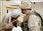 An Iraqi civilian kisses the hand of U.S. Marine Cpl. Joseph Sharp
after Marines from the 1st Battalion 5th Marines gave him a supply
of food and water in Fallujah, Iraq. American officials and civic
leaders from Fallujah called on insurgents Monday to turn in their
weapons, in the first concrete statement to come out of direct
negotiations. Sharp is from Peoria, Ill.