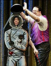 Penn Jilette, right, performs with partner Teller during their show
at the Rio All-Suite Hotel & Casino in Las Vegas. The pair have
been practicing their unique brand of entertainment and magic for
30 years.