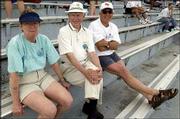 From left, Jan Vaughn, Arkie Vaughn and Tom Groene, all of
Lawrence, attend the Kansas University Relays. They watched the
competition last Saturday at Memorial Stadium.