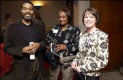 From left, Rene Brown, Vern Norwood and Christine Kenney attend the
Women's Recognition Program at Kansas University. Kenney, a KU
graduate and Douglas County district attorney, was named to the
Women's Hall of Fame during Tuesday's program.