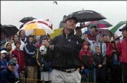 Former Kansas City Royal standout George Brett demonstrates his
golf swing to young golf and baseball fans.