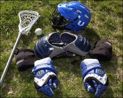 A lacrosse player's gear includes helmet, shoulder pads, elbow pads
and gloves as well as a stick and ball.