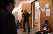 Roger Shimomura jokes with students before his performance art
class last fall at Kansas University. Shimomura is known for his
dry sense of humor, but he also has a reputation as a brutally
honest, though respected, teacher who has reduced students to
tears.