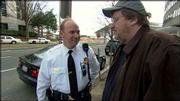 In a scene from Michael Moore&squot;s movie "Fahrenheit 9/11," Moore,
right, talks to a guard at the Saudi embassy in Washington. Moore&squot;s
film, which criticizes President Bush&squot;s handling of the Sept. 11
terrorist attacks and connects the Bush family with Osama bin
Laden&squot;s, won&squot;t be released through Miramax Films on orders from
parent company Disney.