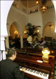 Rick&squot;s Cafe pianist Issam plays in Casablanca, Morocco. In homage
to the 1942 movie "Casablanca," a former U.S. diplomat spent two
years of work and $1 million in investments to bring a real Rick&squot;s
Cafe to Morocco&squot;s largest city.