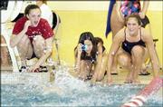 LHS swimmers Kristen Longanecker, Melissa Farve and Kristi Rudman
cheer for teammate Julia Szabo during the 100-yard butterfly
finals.