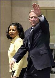 President Bush waves to the crowd after speaking at the Brown v.
Board of Education 50th anniversary commemoration and the grand
opening of the Brown v. Board of Education National Historic Site
in Topeka. Cheryl Brown Henderson, sister of Linda Brown, the
student at the heart of the Topeka lawsuit, accompanied the
president on Monday.