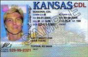 The new Kansas driver's licenses, unveiled Thursday, will be in a
vertical format for people under 21 and horizontal for drivers 21
and older.