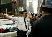 A New York City Police captain, left, deploys police officers in
front of a hotel in Times Square as part of a counterterrorism
deployment initiative that is meant as a show of police force on
city streets in the upcoming busy tourist season. Atty. Gen. John
Ashcroft issued a warning Wednesday of imminent terror threats to
the United States.