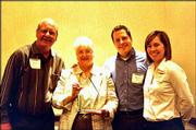 From left, Ron Bisel, his wife Dee Bisel, owner of Minuteman Press,
and their children Ryan Bisel and Adele Bisel accept the 2003
Spirit of Caring Award in the sole proprietor category. They
received the honor April 23 during a Leadership Lawrence
Celebration at the SpringHill Suites by Marriott.