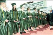 The 17 valedictorians in the Free State High School Class of 2004
receive honors during a commencement ceremony. From left, Ryan
Bodensteiner, Jessica Carlyle, Thomas Duermeier, Evan Ferrier,
Brian Garland, Jennifer Gwaltney and Anne Laue-Minden, Hazel Morley
and Dominique Nunez can be seen. At right is Supt. Randy Weseman.
The ceremony was May 15 at Memorial Stadium.