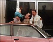 William Stern holds his daughter, then known as Baby M, after her
visit with her birth mother, Mary Beth Whitehead, in Hackensack,
N.J., in this Jan. 16, 1987, file photo. Whitehead acted as a paid
surrogate mother for Stern and his wife but refused to give up
custody after the girl was born. Since that case, only about 19
states have enacted laws regulating surrogate motherhood; a case in
April in Pennsylvania prompted a judge to urge lawmakers to set
standards on the issue.