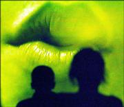 A pair of lips blows out smoke during the screening of the film
"Passing the Test," at the KAN Film Festival. The film, which was
directed and produced by Carrie Lutz and Emily Miles, both high
school students from Springfield, Mo., was one of about 80 films
shown Saturday at the festival at the Lawrence Arts Center, 940
N.H. "Passing the Test," explores students&squot; opinions on drug
testing.