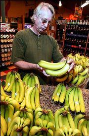 Pete Wyman, of Baldwin, is a frequent shopper at the Community
Mercantile Co-op, 901 Iowa. He shopped Wednesday at the store,
which recently was named National Co-op Retailer of the Year by the
Consumer Cooperative Management Assn.