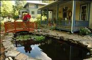 Mark Lehman and Diana Chamberlain have transformed their yard into
a water garden. The water garden will be featured Saturday and June
27 at the Sunflower Water Garden Society's Water Garden Tour.