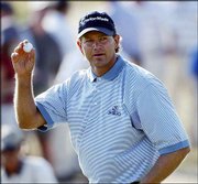 Retief Goosen acknowledges the crowd after parring the 16th hole
during the third round of the U.S. Open. Goosen was one of only
three players to break par Saturday at Shinnecock Hills Golf Club
in Southampton, N.Y.