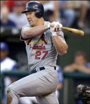 Scott Rolen drives the ball down the third-base line for a
three-run double in the third inning. Rolen powered the Cardinals
to a 5-2 victory over the Royals on Friday in Kansas City, Mo.