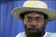 An expressive Charles Pace tells a folktale during a children's
workshop in the Chautauqua tent at South Park. Pace, who portrays
Frederick Douglass during several Chautauqua events, presented the
folktales Friday.