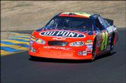 Jeff Gordon turns a corner during qualifying for Sunday's
Dodge/Save Mart 350. Despite a wild run, Gordon won the pole Friday
at the Infineon Raceway in Sonoma, Calif.