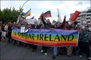 Demonstrators protest outside the entrance to Shannon Airport. U.S.
President Bush arrived Friday in Ireland for the annual
U.S.-European Union summit.
