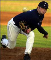 The Raiders' Ryne Jackson delivers a pitch in Lawrence's 4-0
victory over Hays. Jackson picked up the victory in the Al Ice
Memorial Woodbat Classic on Friday at Hoglund Ballpark.