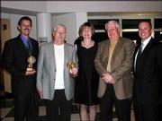 Steve Steinbach, left, and Dick Leines, second from the left, hold
their 2004 Caring & Commitment Awards for their significant
contributions to Cottonwood Inc. They have worked for the
organization for more than 10 years. They posed with Cottonwood
Inc. executive director Sharon Spratt and the presidents of the
Cottonwood Foundation and Cottonwood Inc. board of trustees, John
Tacha and Kelly Drake. They received the honors during the
Cottonwood Classies on April 26 at Lawrence High School.