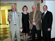 Tom Groene, left, Cottonwood Foundation treasurer, poses with
Cottonwood Inc. executive director Sharon Spratt and the presidents
of the Cottonwood Foundation and Cottonwood Inc. board of trustees,
John Tacha and Kelly Drake. Groene was recognized for his years of
dedication and service to Cottonwood as a member of the Cottonwood
Foundation board of trustees and his many years of working with the
Kansas Open golf tournament. He was recognized during the
Cottonwood Classies on April 26 at the Lawrence High School
auditorium.