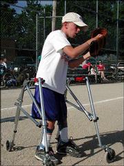 Zach Herries catches a ball while warming up for a Lawrence Park
and Recreation Unified youth softball league. Zach said his
favorite part about playing baseball is throwing.