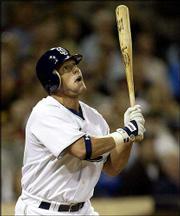 San Diego's Brian Giles gazes at the flight of his three-run home
run in the sixth inning against Kansas City. The Padres beat the
Royals, 7-5, Friday in San Diego.