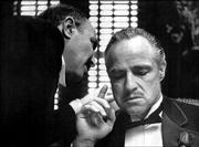 Bonasera, left, portrayed by Frank Puglia, asks Don Vito Corleone,
portrayed by Marlon Brando, for a favor in a scene from the 1972
movie "The Godfather." Brando, acclaimed as the greatest actor of
his generation, died Thursday at age 80.