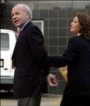 Former Enron CEO Kenneth Lay walks into federal court in Houston.
He pleaded innocent Thursday to federal charges of conspiracy and
fraud.