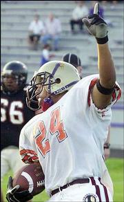 Bracey Billie of the East celebrates a touchdown against the West.
The East won, 34-7, Saturday at Haskell Stadium.
