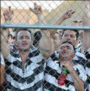 Inmates sing along to Glen Campbell&squot;s "Rhinestone Cowboy" in
Phoenix, where . Campbell was given a 10-day sentence for DUI.
Campbell treated about 1,000 fellow inmates to concert Friday.