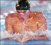 Lawrence Aquahawk Alex Brunfeldt pushes through the water. He raced
in the 100 breaststroke during the Roger Hill Invitational on
Saturday.